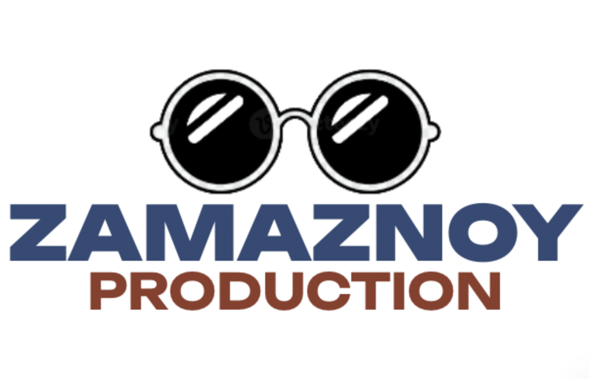 Back of a man at a concert. Hes wearing a beanie hat and a baggy denim jacket with studs. Photo with a purple hue